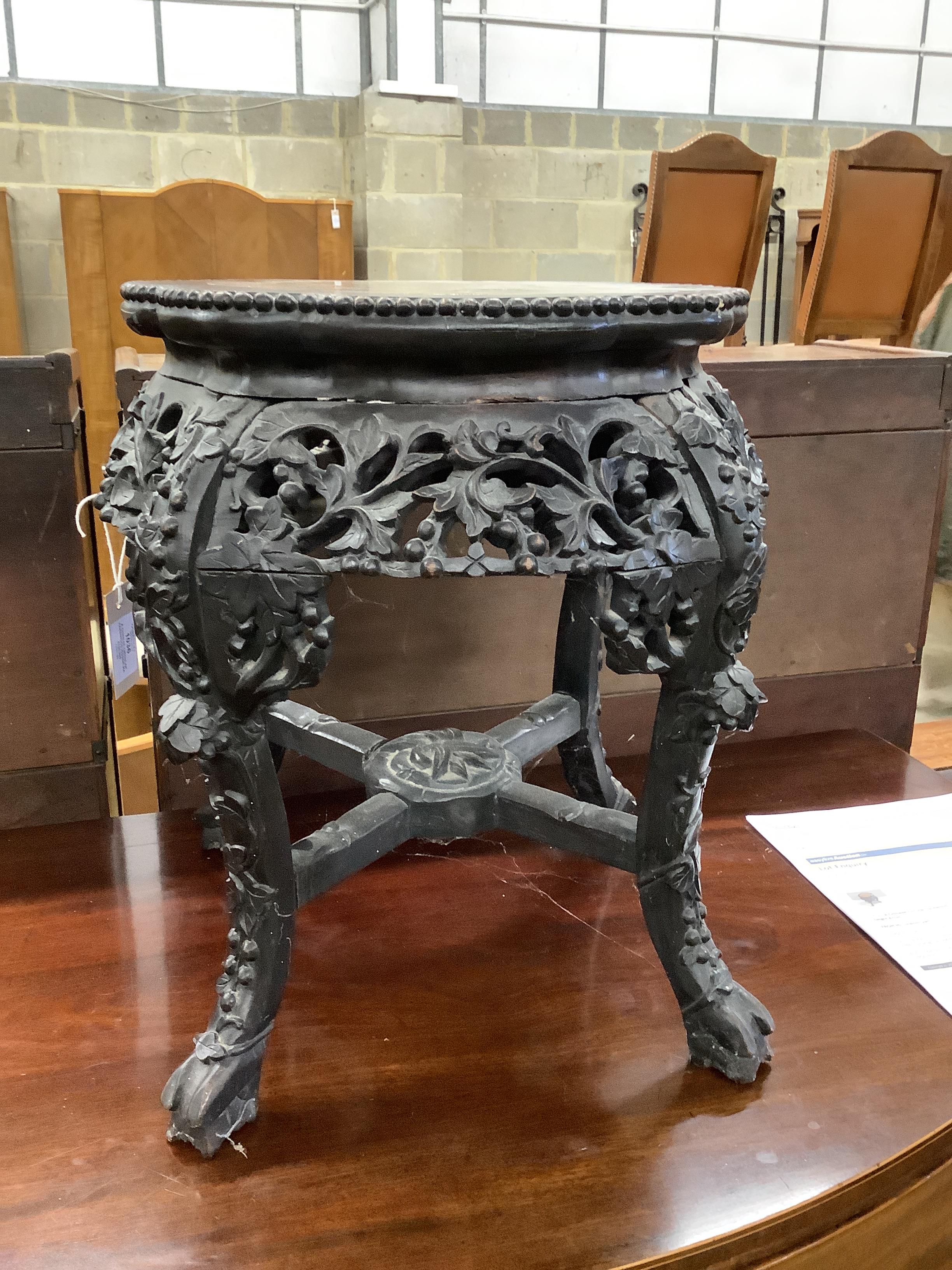 A Chinese circular hardwood rouge marble topped jardiniere stand, diameter 42cm, height 47cm